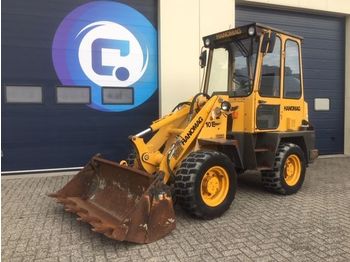 Radlader Hanomag 10E Shovel/ Wiellader Perkins motor + 4-1 Laadschop + Palletvorken: das Bild 1