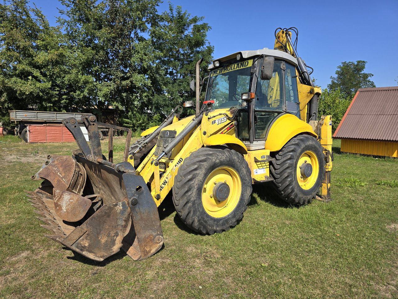 NEW HOLLAND B115-4PS - Baggerlader: das Bild 2 NEW HOLLAND B115-4PS - Baggerlader: das Bild 2