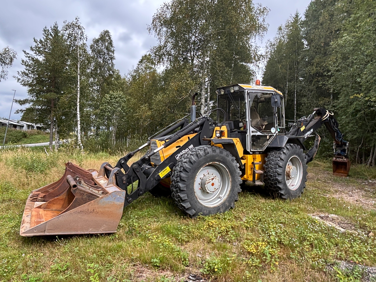 Huddig 1160 - Baggerlader: das Bild 1 Huddig 1160 - Baggerlader: das Bild 1
