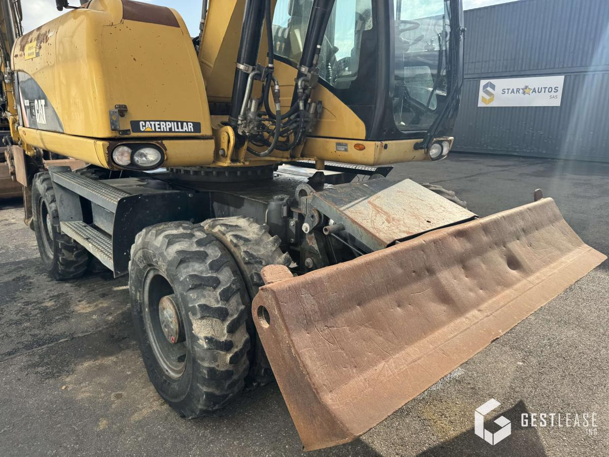 Mobilbagger Caterpillar M313D: das Bild 7 Mobilbagger Caterpillar M313D: das Bild 7