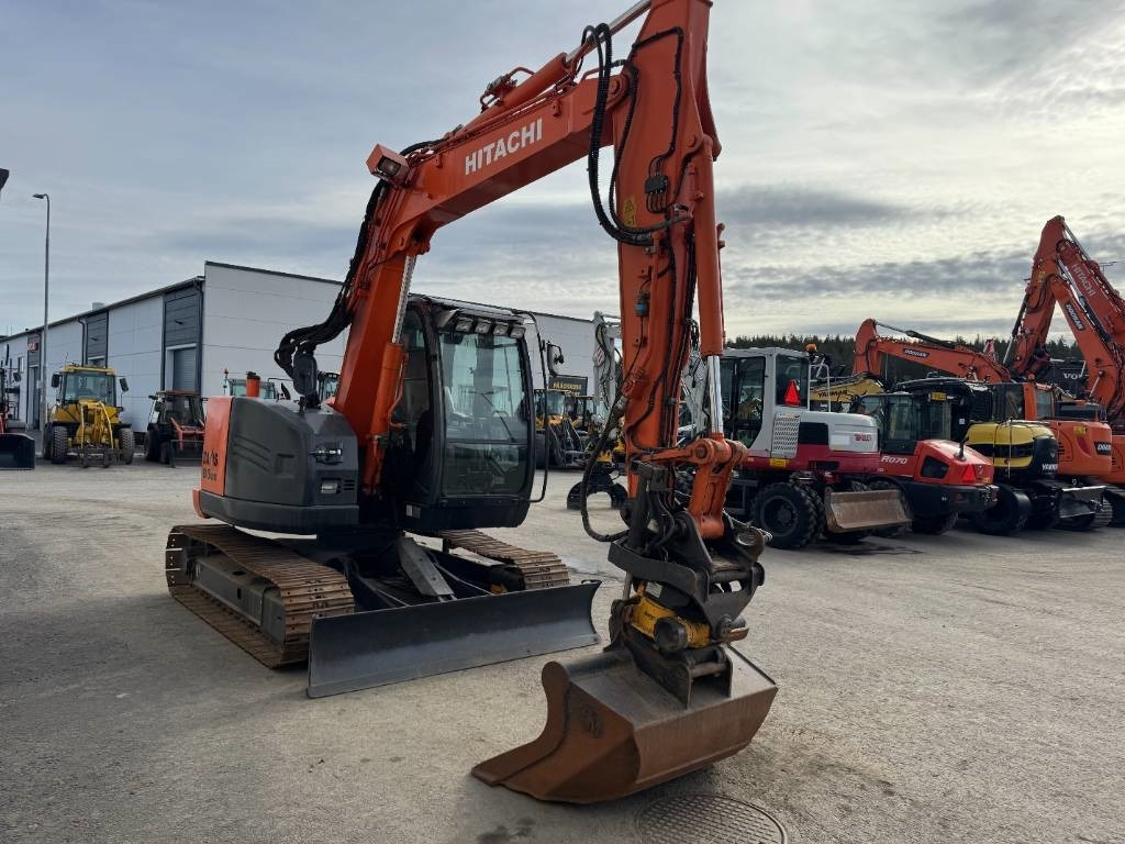 Hitachi ZX85US-5 Pyörittäjä, 3-Kauhaa - Minibagger: das Bild 5 Hitachi ZX85US-5 Pyörittäjä, 3-Kauhaa - Minibagger: das Bild 5
