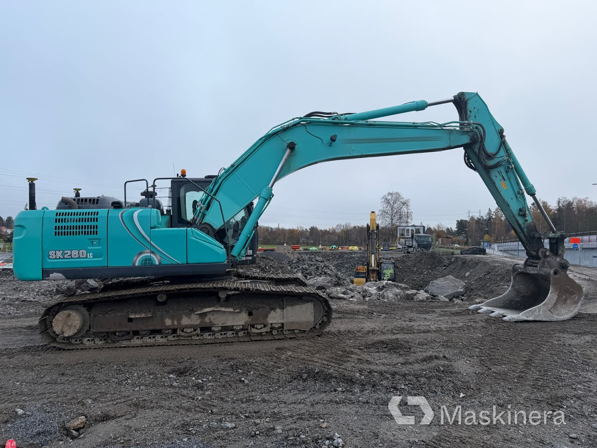 Grävmaskin Kobelco SK260LC-10 - Kettenbagger: das Bild 4 Grävmaskin Kobelco SK260LC-10 - Kettenbagger: das Bild 4