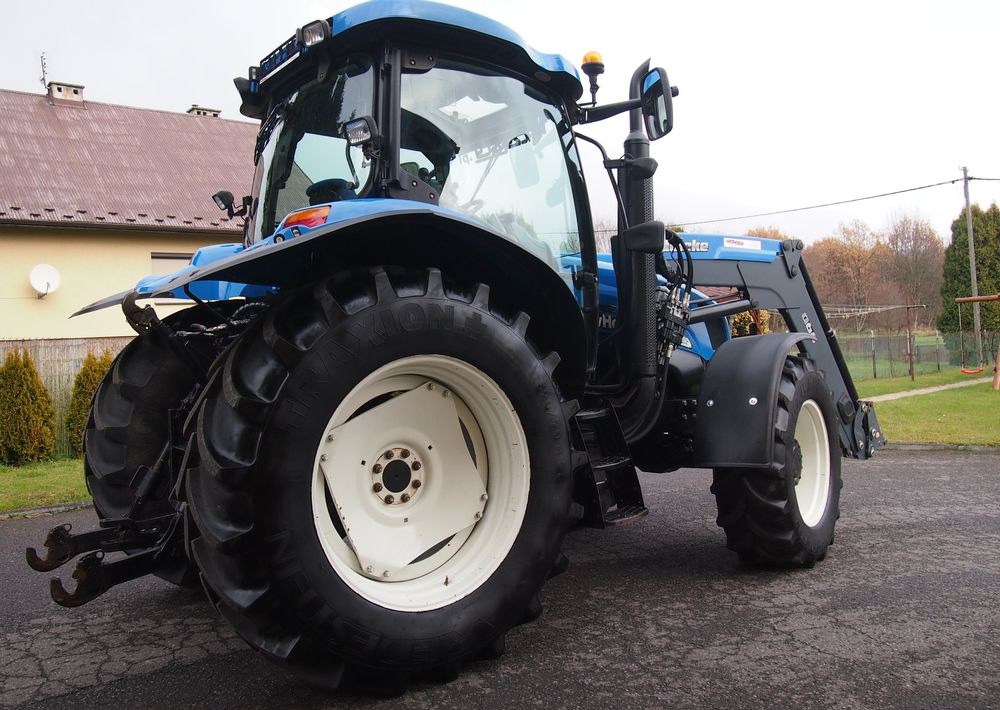 Ciągnik New Holland NH TS125A 6 cylindrów 2004 Ciągnik rolniczy New Holland TS125A - Traktor: das Bild 4 Ciągnik New Holland NH TS125A 6 cylindrów 2004 Ciągnik rolniczy New Holland TS125A - Traktor: das Bild 4