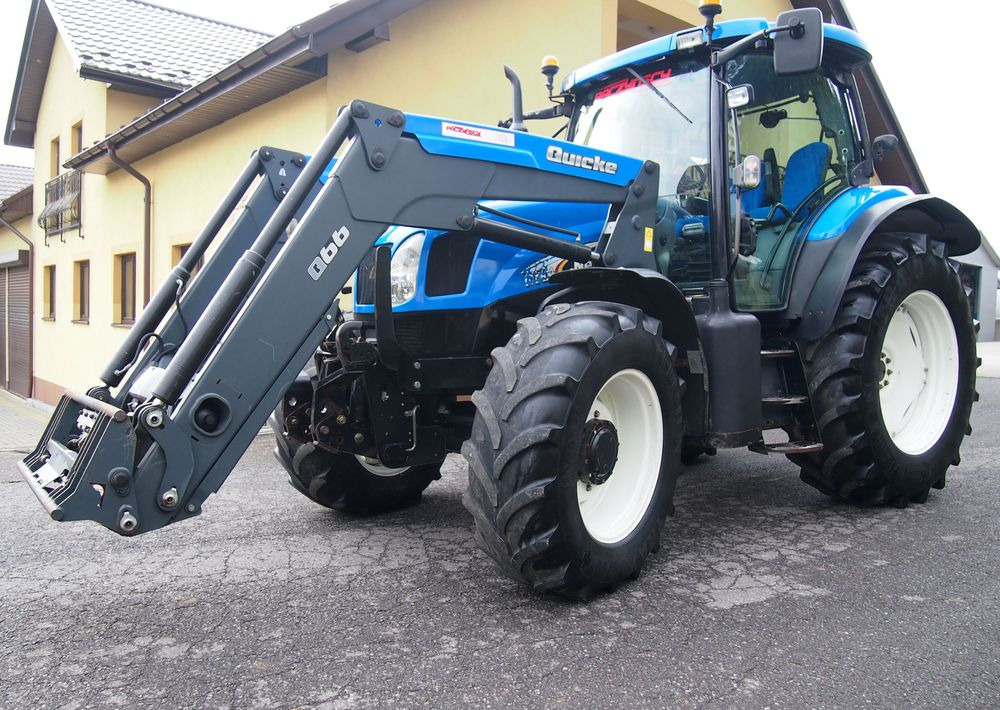 Ciągnik New Holland NH TS125A 6 cylindrów 2004 Ciągnik rolniczy New Holland TS125A - Traktor: das Bild 1 Ciągnik New Holland NH TS125A 6 cylindrów 2004 Ciągnik rolniczy New Holland TS125A - Traktor: das Bild 1