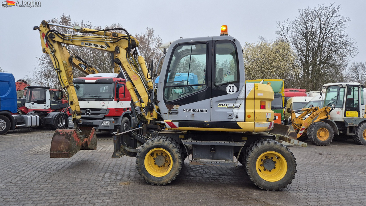 New Holland MH 2.6 Zustand gut, deutsche Maschine incl. Greifer und Dreservo - Mobilbagger: das Bild 1 New Holland MH 2.6 Zustand gut, deutsche Maschine incl. Greifer und Dreservo - Mobilbagger: das Bild 1