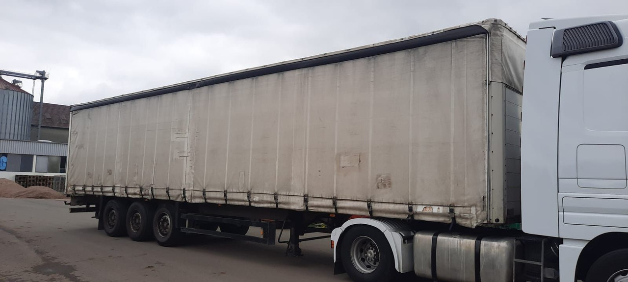 Schmitz Cargobull 3-Achser Pritsche Plane - Planenauflieger: das Bild 1 Schmitz Cargobull 3-Achser Pritsche Plane - Planenauflieger: das Bild 1