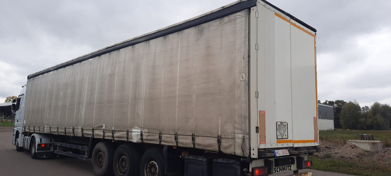 Schmitz Cargobull 3-Achser Pritsche Plane - Planenauflieger: das Bild 2 Schmitz Cargobull 3-Achser Pritsche Plane - Planenauflieger: das Bild 2