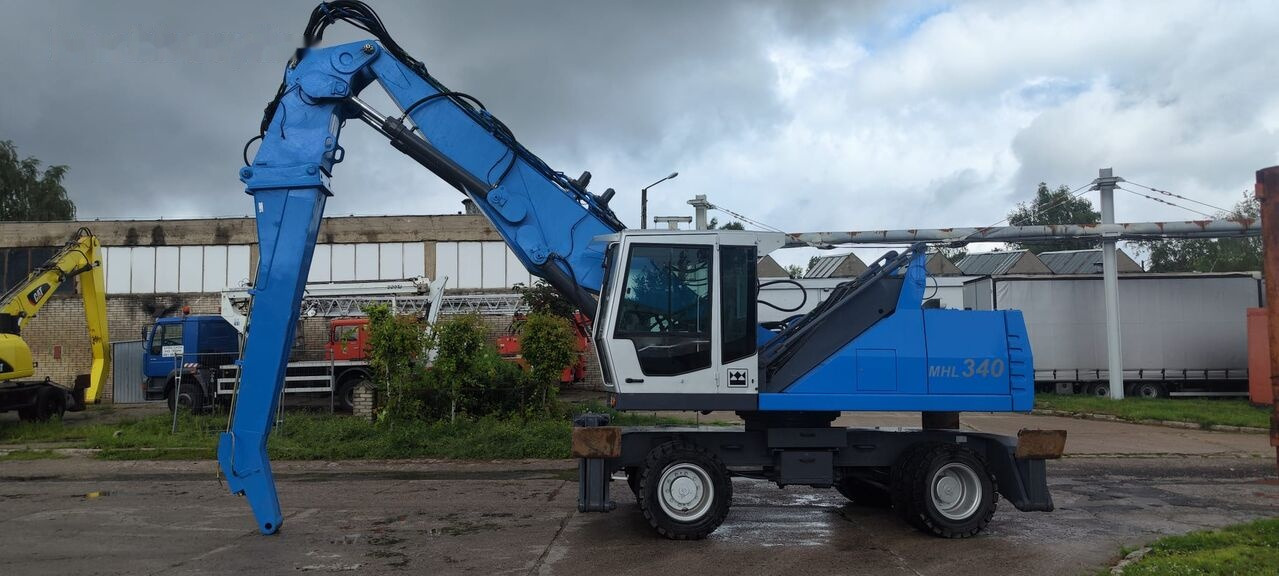 Fuchs MHL 340 D FQC magnet generator - Umschlagbagger: das Bild 1 Fuchs MHL 340 D FQC magnet generator - Umschlagbagger: das Bild 1