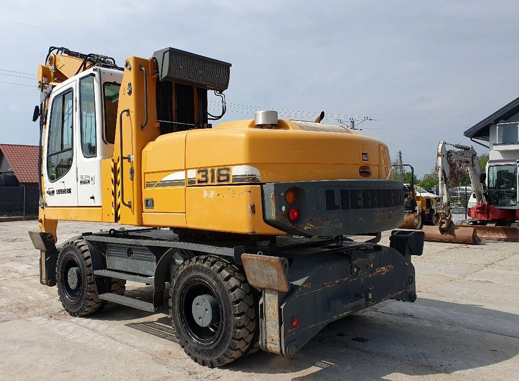 Liebherr A 316 Litronic - Umschlagbagger: das Bild 2 Liebherr A 316 Litronic - Umschlagbagger: das Bild 2