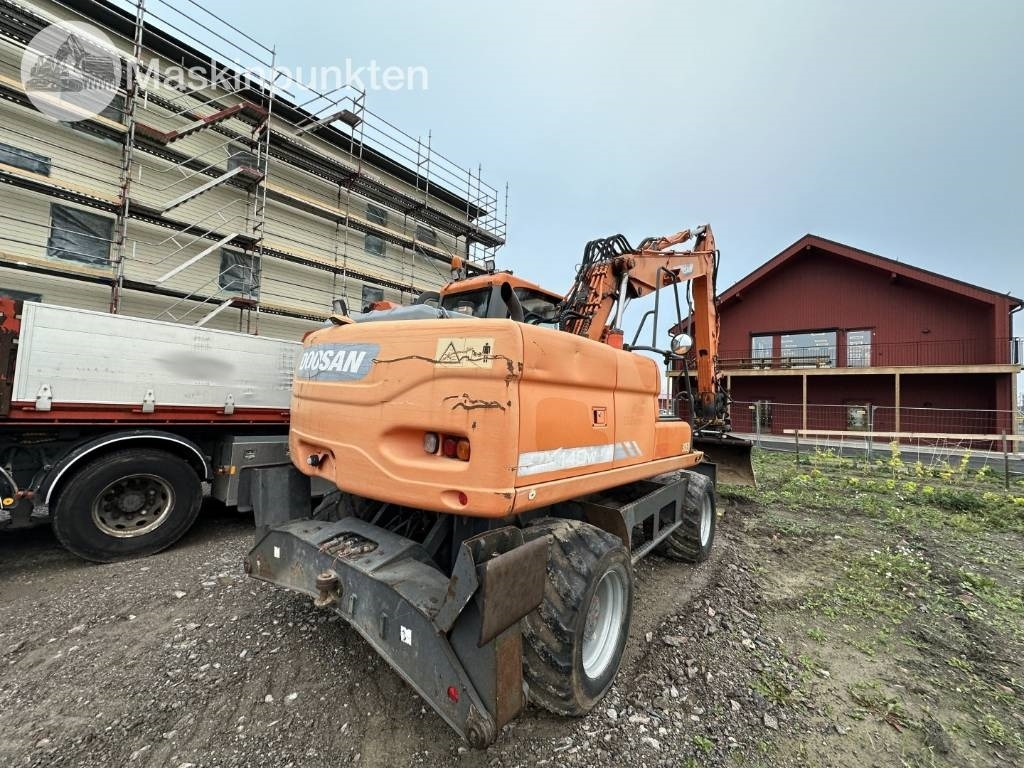 Doosan DX 140 W med vagn och redskap - Mobilbagger: das Bild 4 Doosan DX 140 W med vagn och redskap - Mobilbagger: das Bild 4
