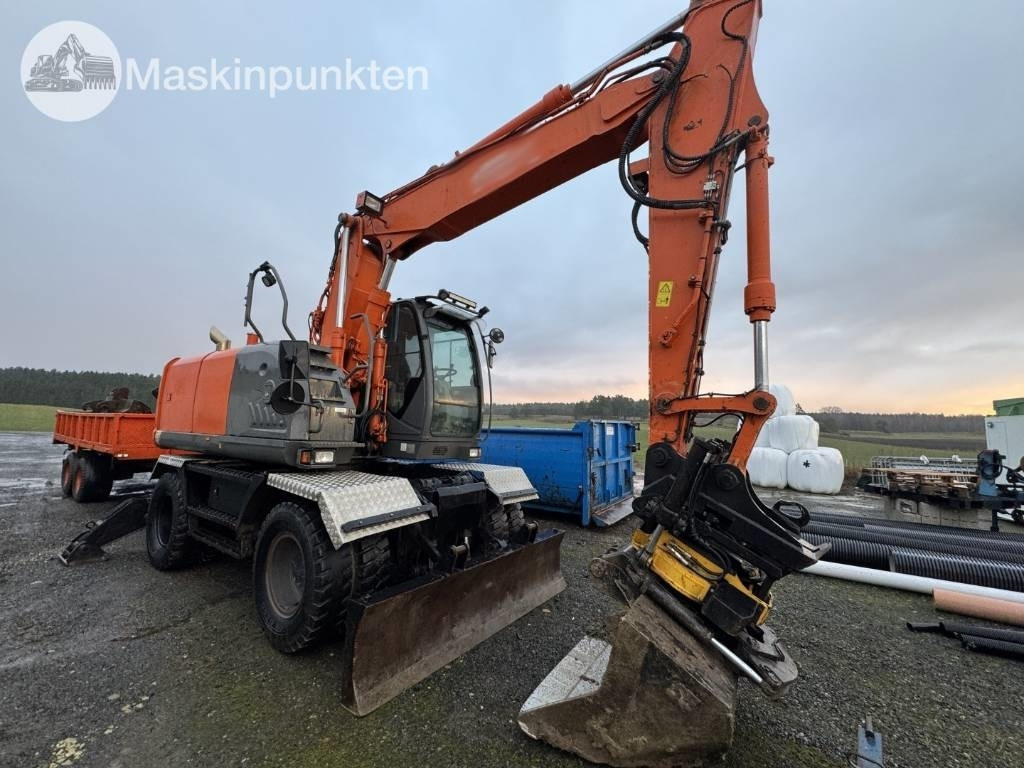 Hitachi ZX 140 W-3 Med vagn och redskap! - Mobilbagger: das Bild 4 Hitachi ZX 140 W-3 Med vagn och redskap! - Mobilbagger: das Bild 4