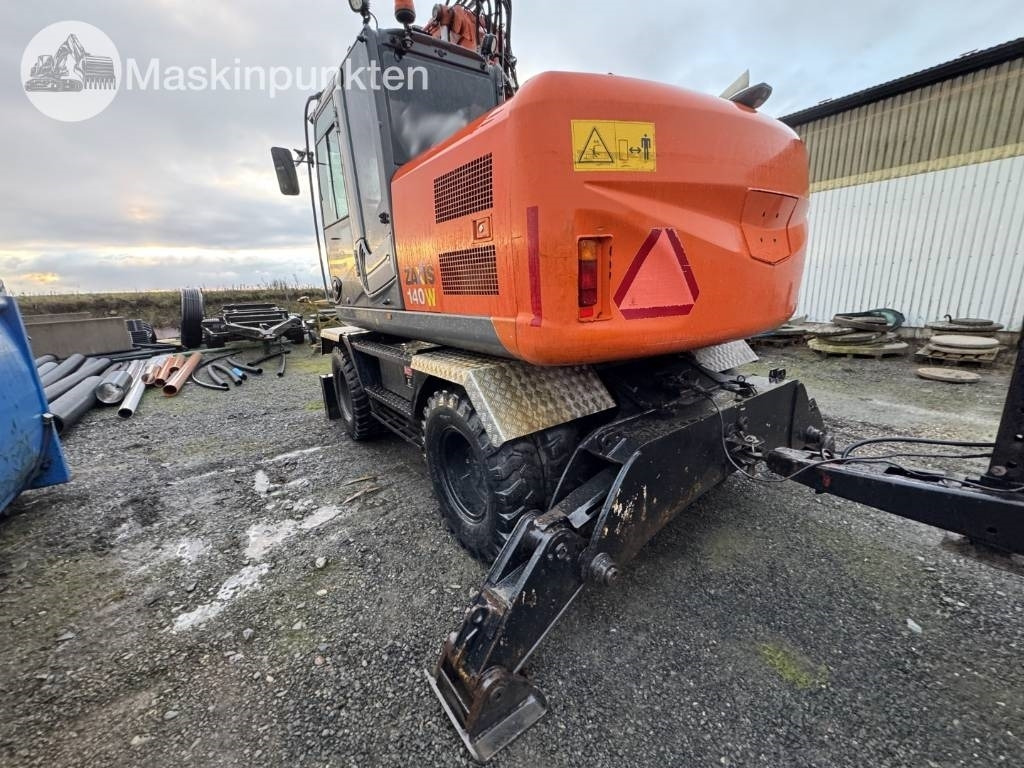 Hitachi ZX 140 W-3 Med vagn och redskap! - Mobilbagger: das Bild 2 Hitachi ZX 140 W-3 Med vagn och redskap! - Mobilbagger: das Bild 2