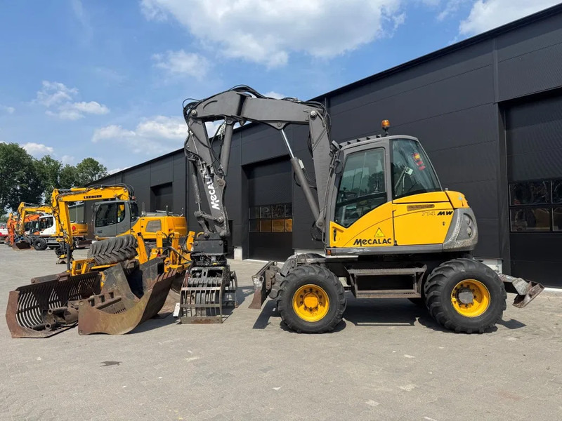 Mecalac 714MW FULL ATTACHMENTS OVERCOMPLEET !!! - Mobilbagger: das Bild 1 Mecalac 714MW FULL ATTACHMENTS OVERCOMPLEET !!! - Mobilbagger: das Bild 1