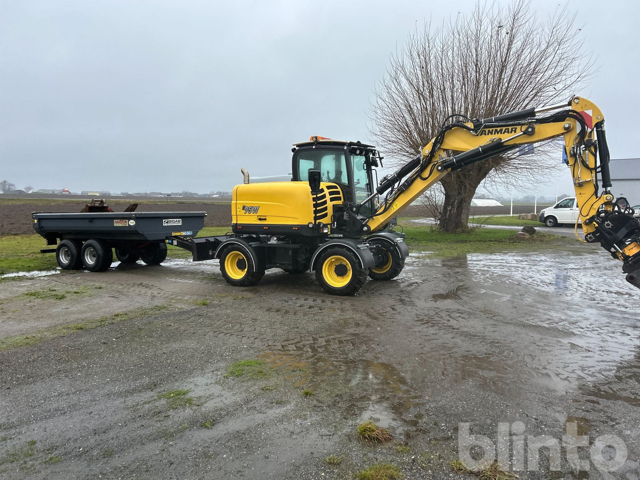 Yanmar B95W - Tippvagn - Tiltrotator - 6 Redskap - Mobilbagger: das Bild 5 Yanmar B95W - Tippvagn - Tiltrotator - 6 Redskap - Mobilbagger: das Bild 5